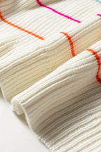 Close-up of a white v neck striped sweater with vibrant color stripes and ribbed texture