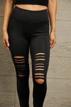 Black leggings with stylish cutouts and a wide waistband for comfort and support