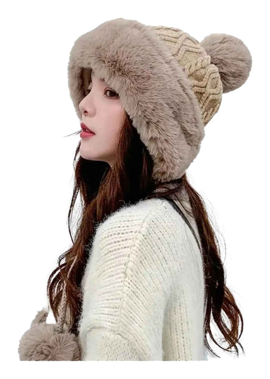 Cozy winter knitted balaclava hat in beige with pom-poms for warmth and style