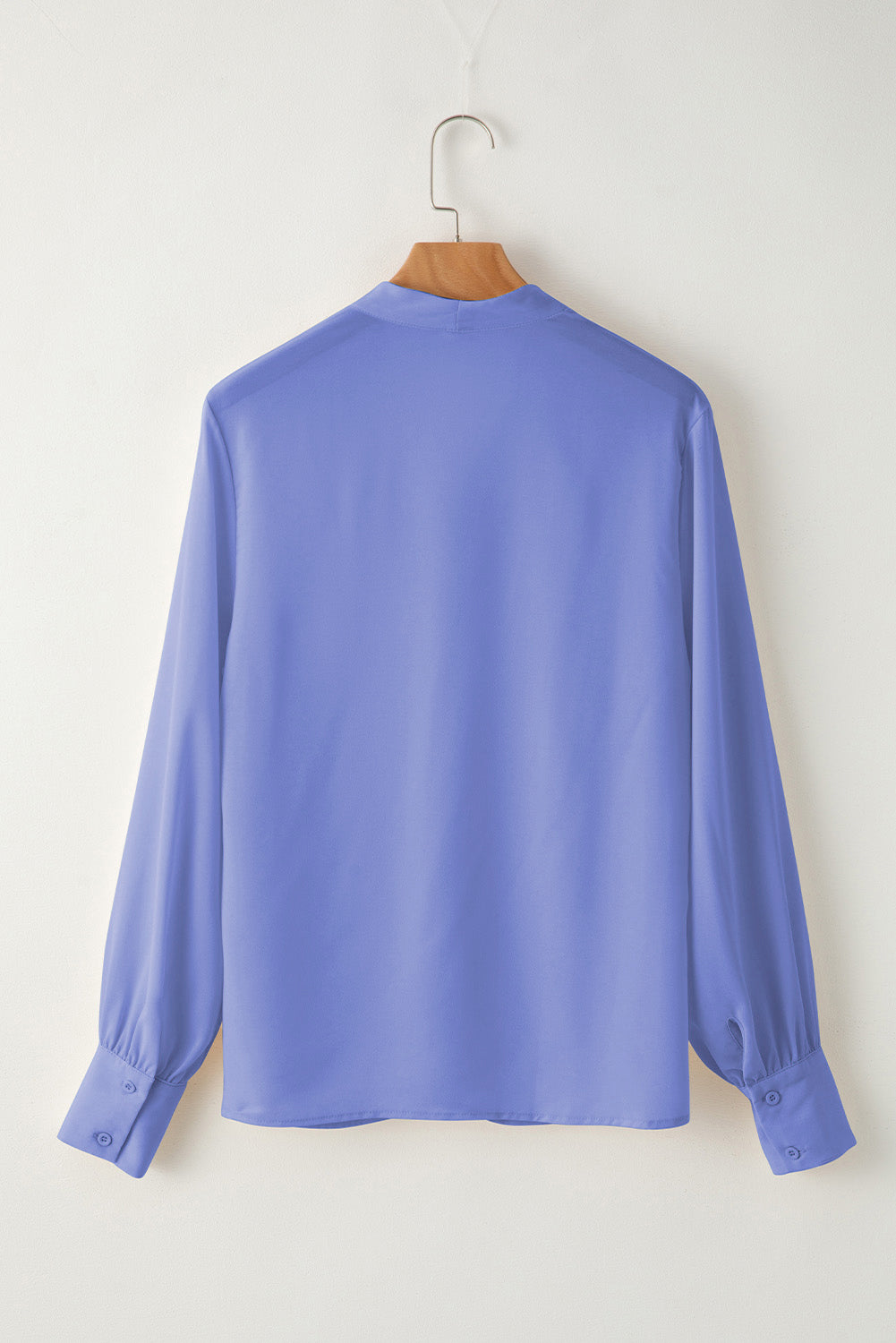 Back view of a light purple women blouse long sleeve with buttoned cuffs by LuckeLadybug LLC