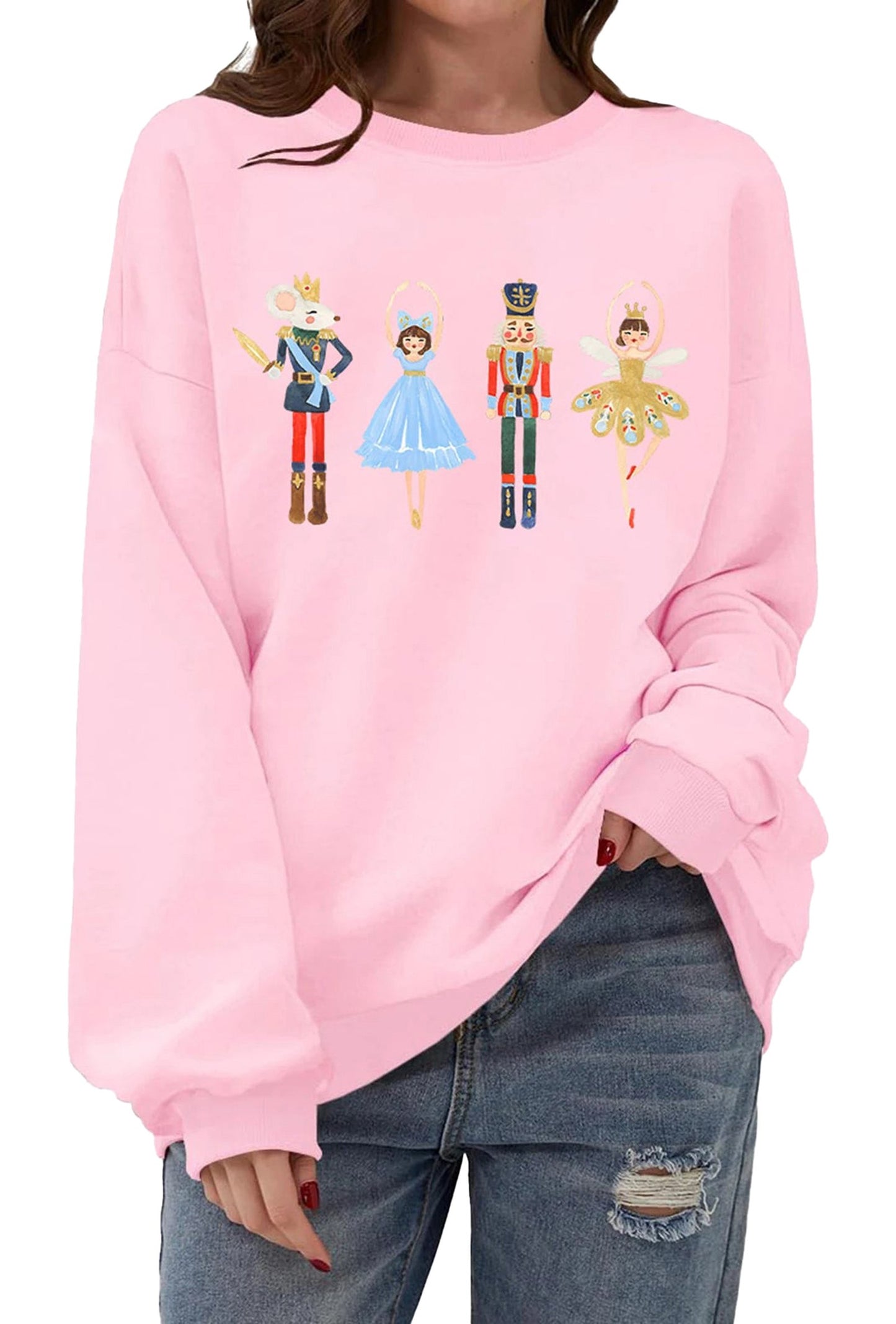 Cute women's Christmas pullover sweatshirt in pink featuring nutcracker characters design
