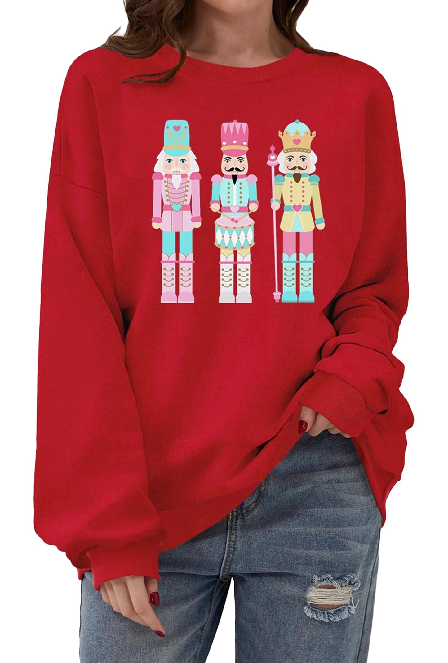 Bright red women's Christmas pullover sweatshirt featuring playful nutcracker characters