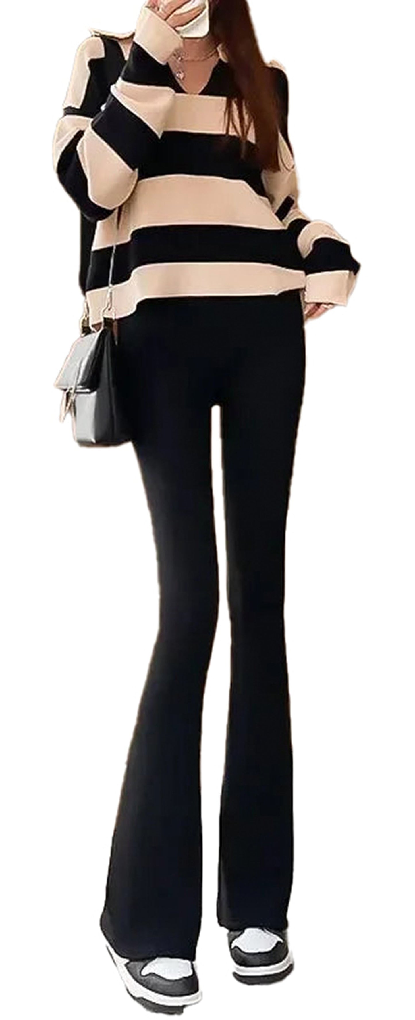 Woman wearing gothic bell-bottom leggings for women with a striped top and casual shoes