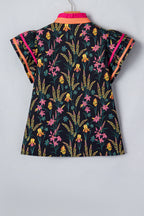 LuckeLadybug short sleeve women blouse featuring a vibrant floral pattern with colorful accents