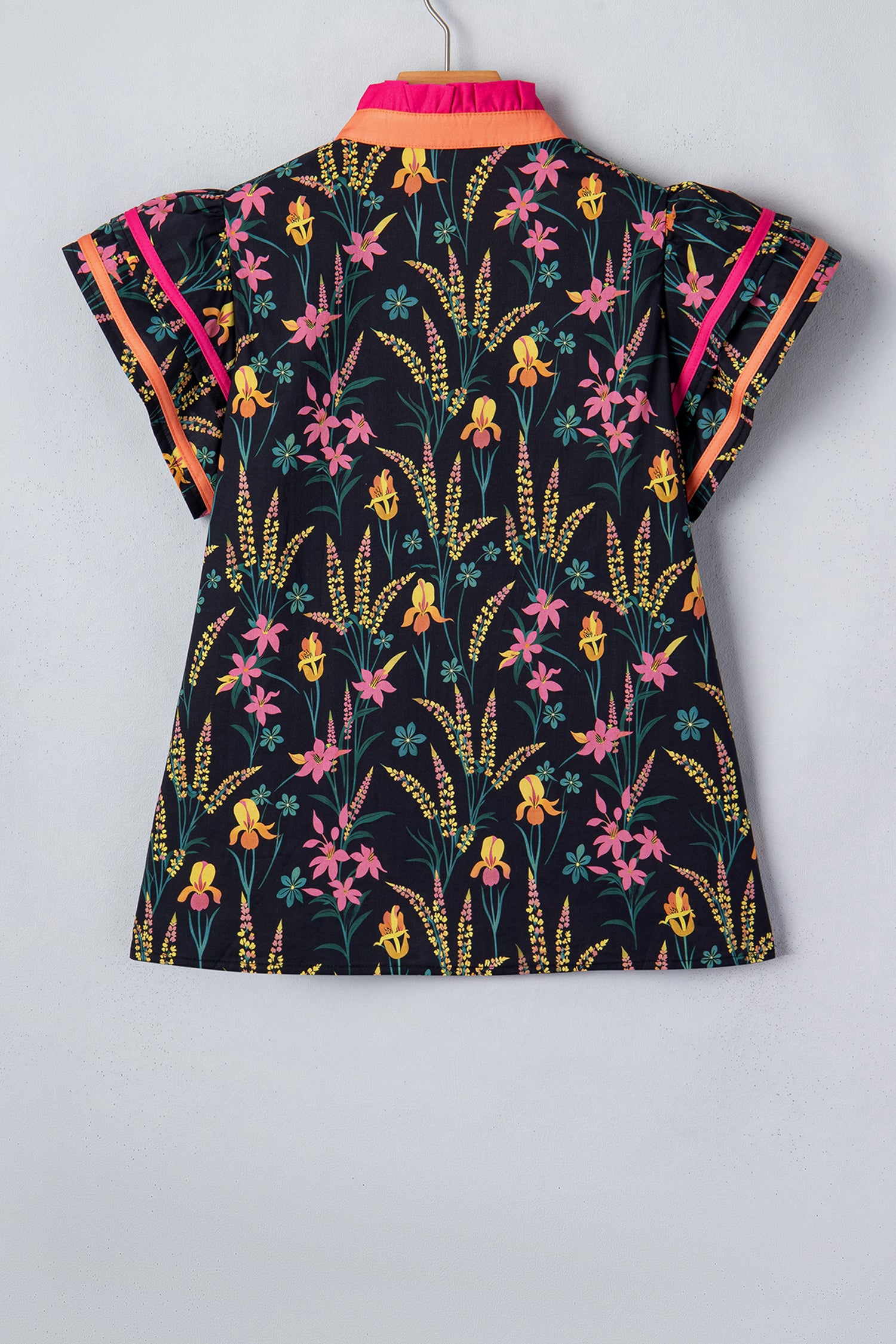LuckeLadybug short sleeve women blouse featuring a vibrant floral pattern with colorful accents