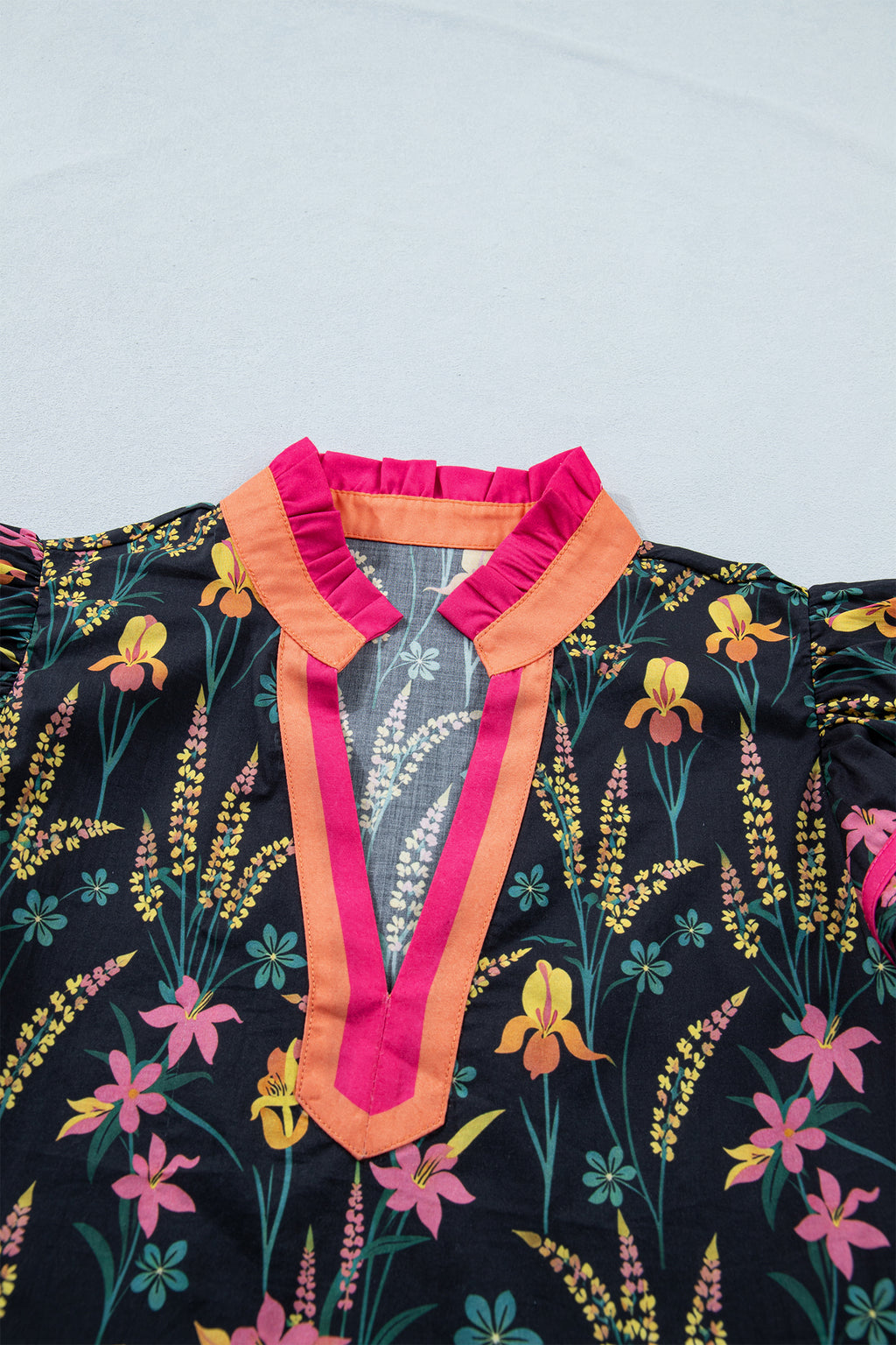 LuckeLadybug LLC short sleeve women blouse with colorful floral patterns and a stylish neckline