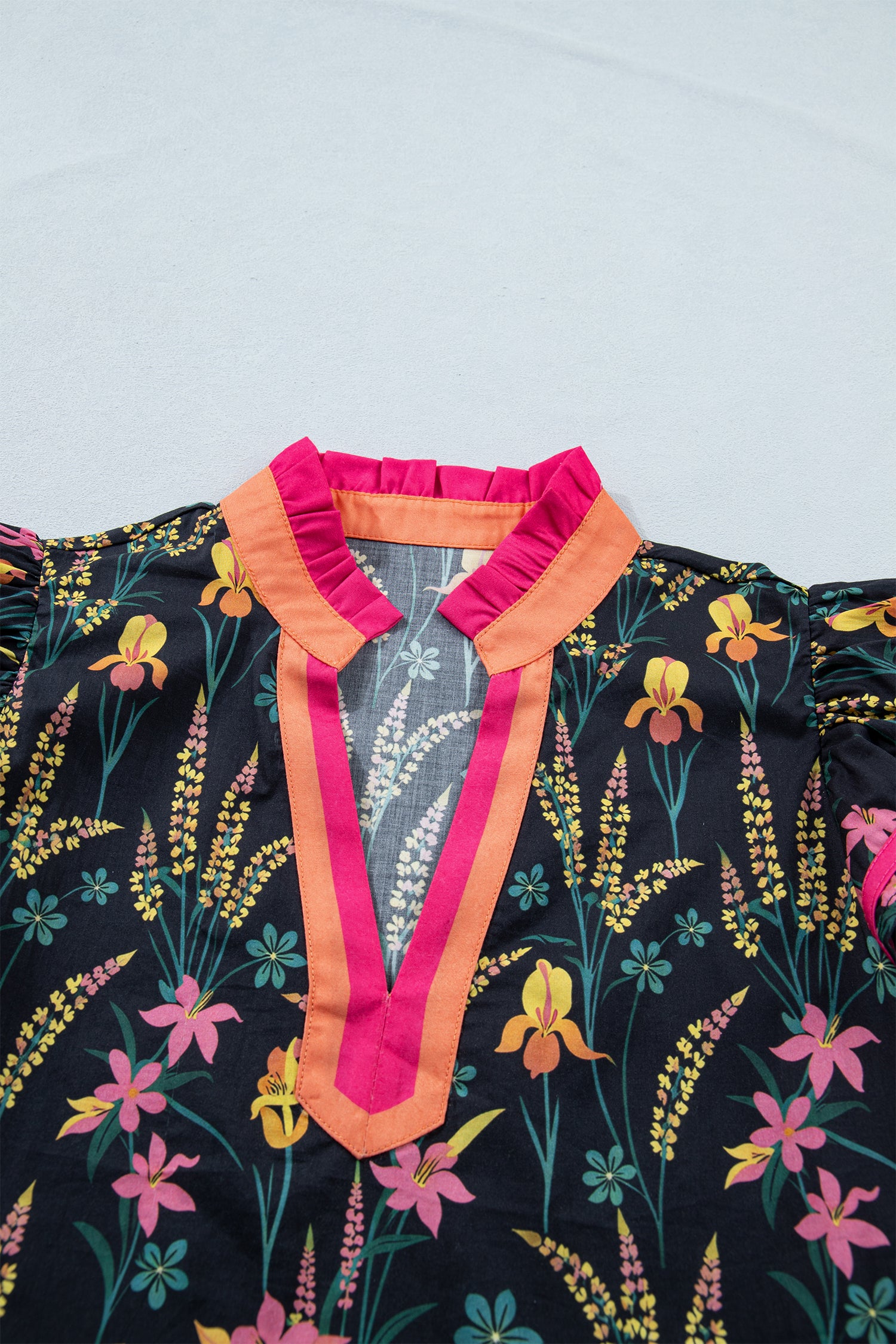 LuckeLadybug LLC short sleeve women blouse with colorful floral patterns and a stylish neckline
