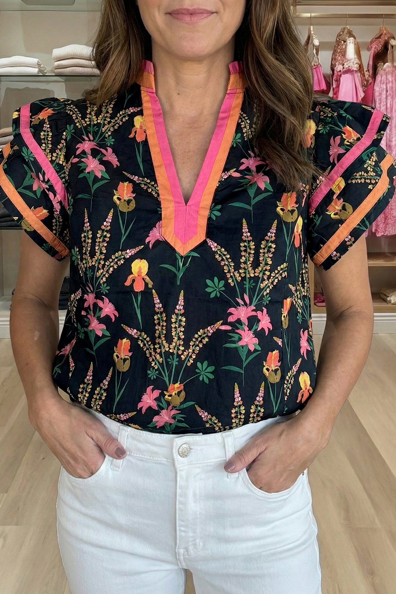 LuckeLadybug short sleeve women blouse with vibrant floral print and pink trim, perfect for casual outings