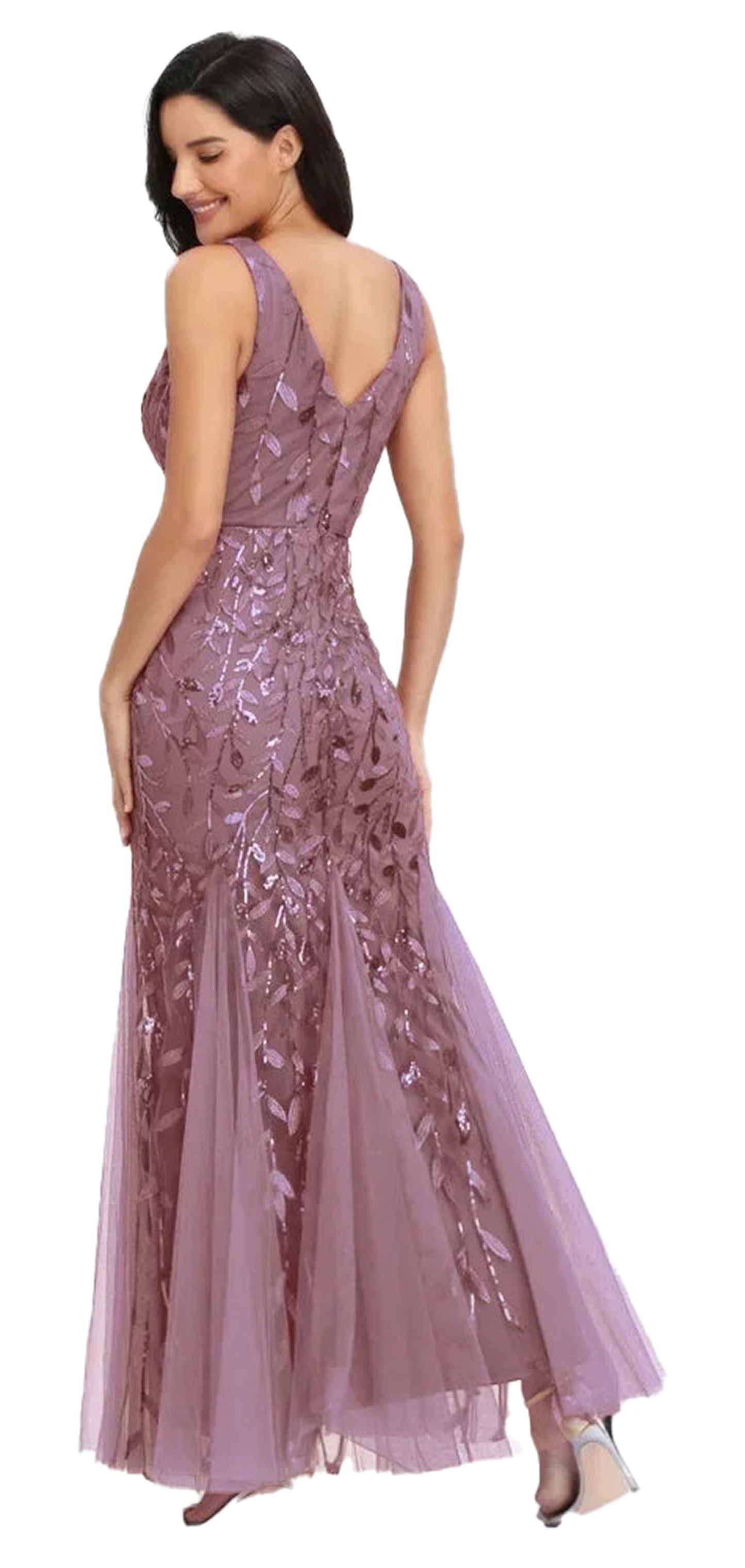 Elegant back view of a women's beaded evening gown in soft lavender with floral details and a flowing skirt