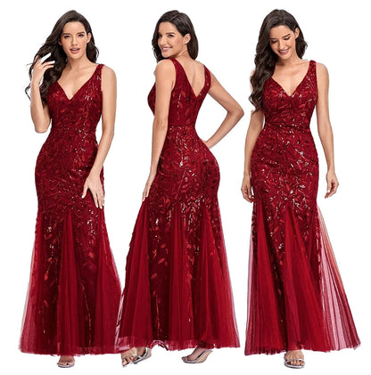 Elegant women's beaded evening gown in red with a fitted bodice and flowing tulle skirt
