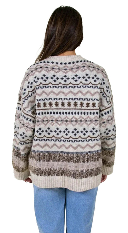 Back view of a cozy women's Christmas sweater with festive patterns in neutral tones