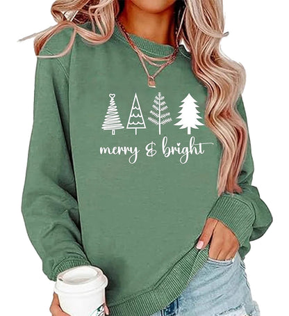 Green womens Christmas tree sweatshirt featuring festive tree designs and the phrase merry & bright