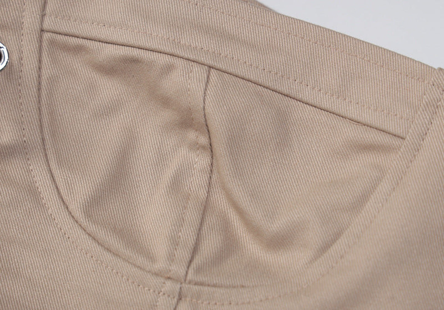 Beige women's corset crop top with structured design and elegant stitching details