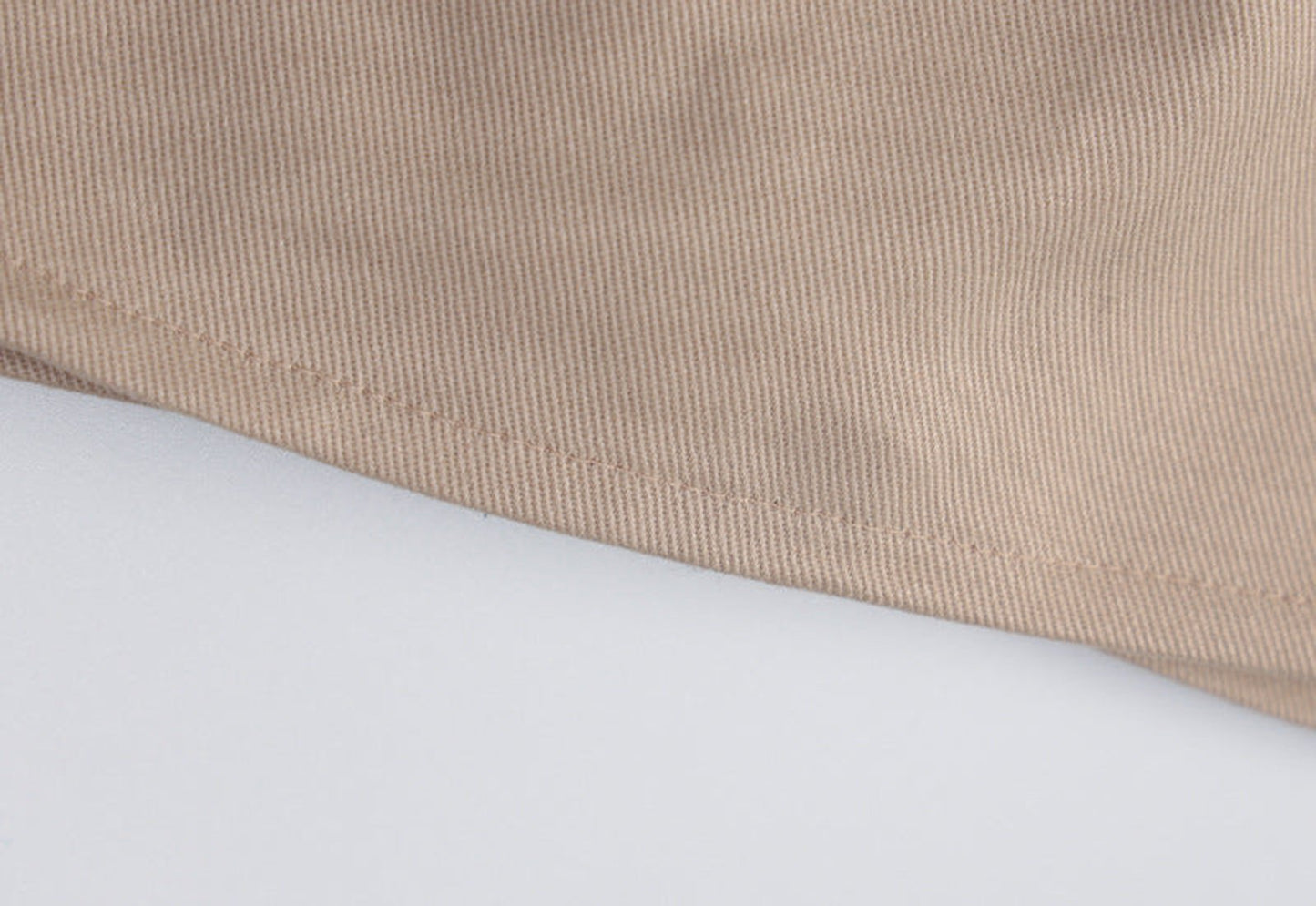 Close-up of a beige women's corset crop top showcasing soft fabric and detailed stitching