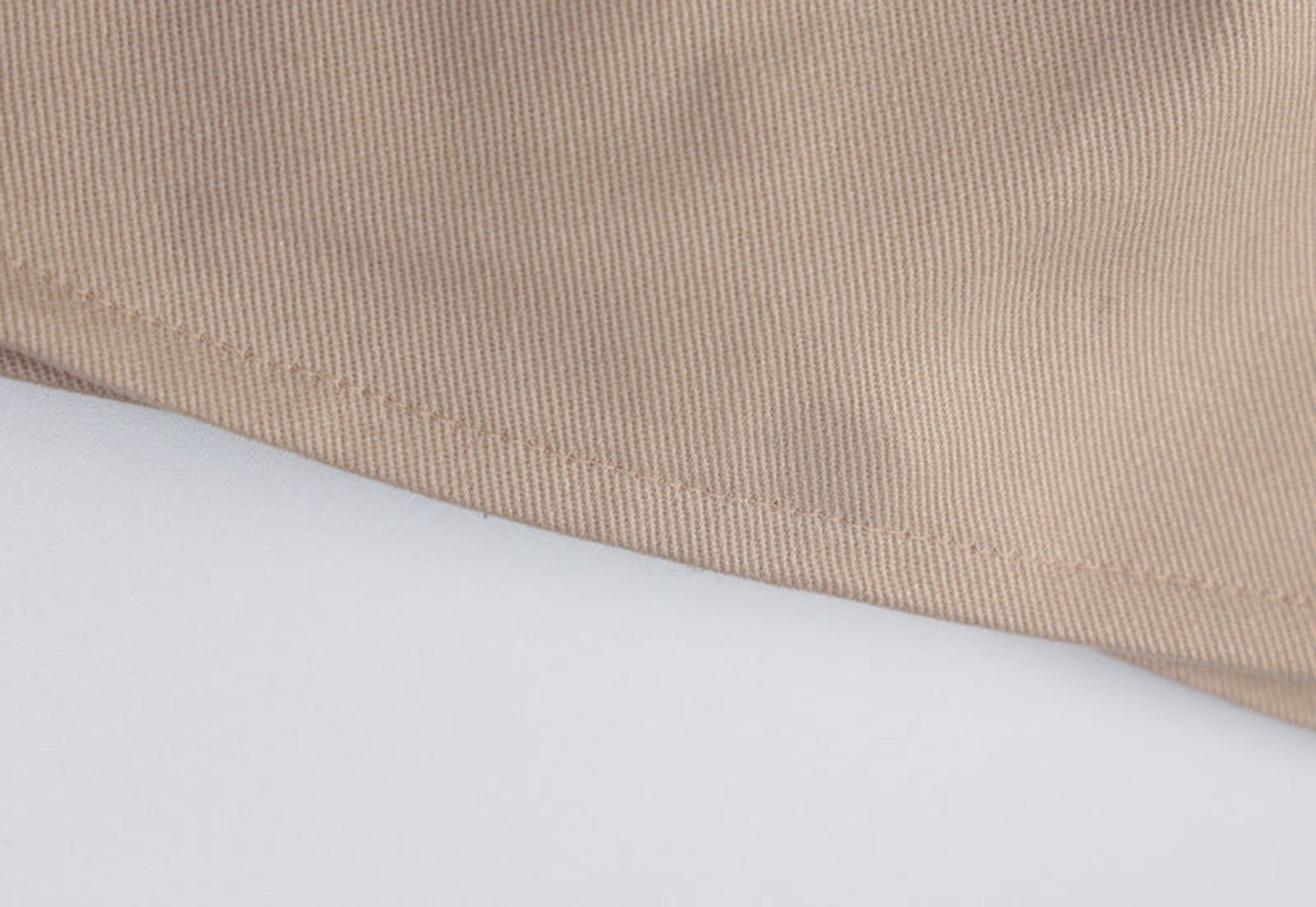 Close-up of a beige women's corset crop top showcasing soft fabric and detailed stitching