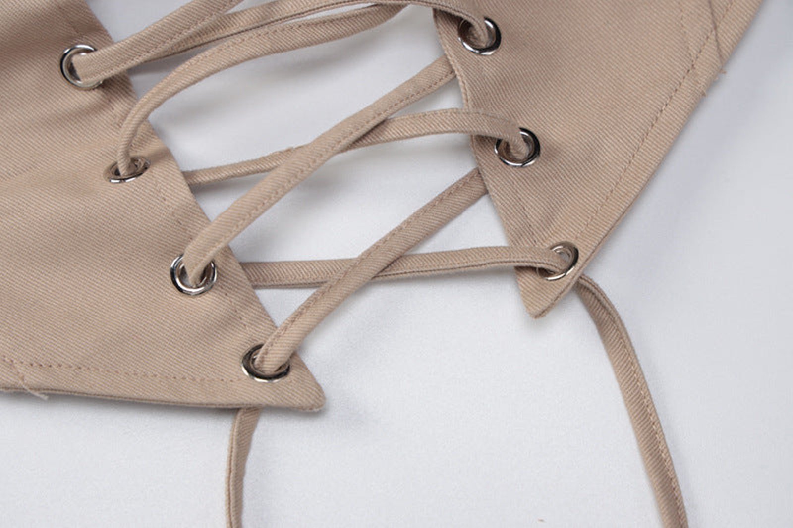 Beige women's corset crop top with lace-up detail and metal eyelets for a stylish look