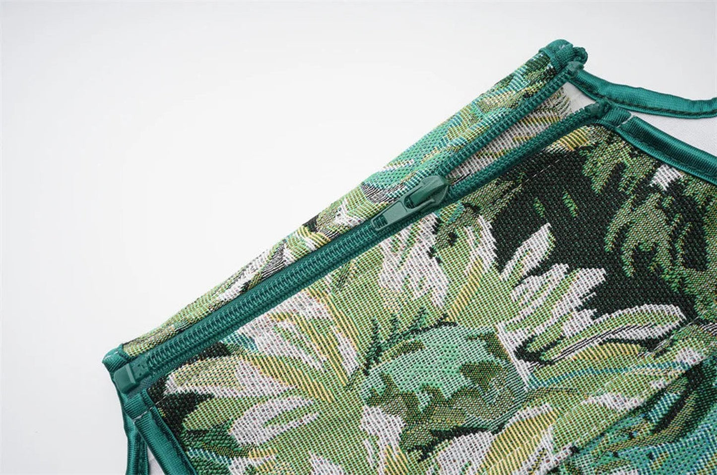 LuckeLadybug LLC women's corset top featuring a tropical leaf print and zip closure