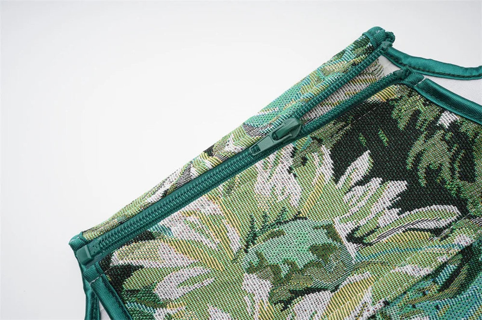 LuckeLadybug LLC women's corset top featuring a tropical leaf print and zip closure