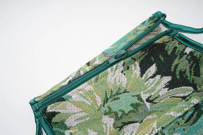 LuckeLadybug LLC women's corset top featuring a tropical leaf print and zip closure