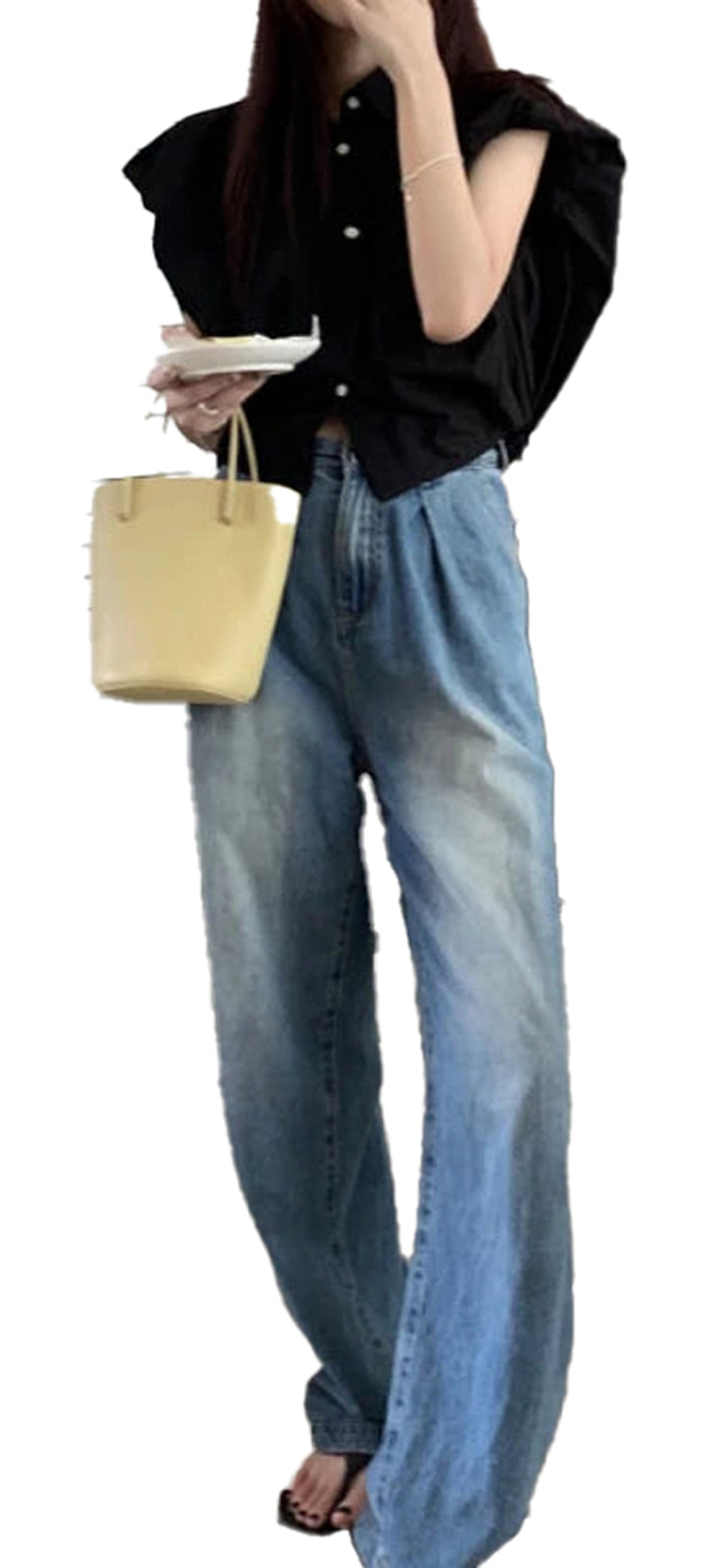 Stylish women's crop top shirt in black with puffed sleeves paired with high-waisted jeans