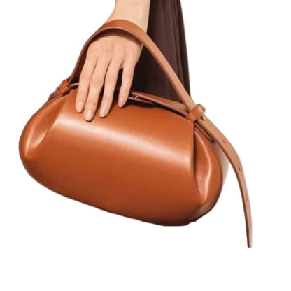 Stylish women's crossbody round bag in rich brown leather, perfect for everyday use and versatile outfits