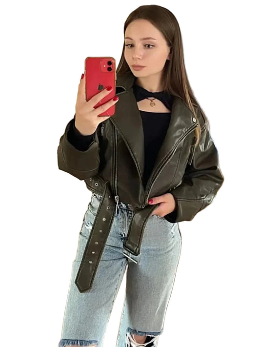 Chic women's faux leather biker jacket in olive green, styled with a black top and distressed jeans