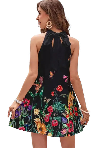 Back view of a women's floral print mini dress featuring colorful embroidery on a black background