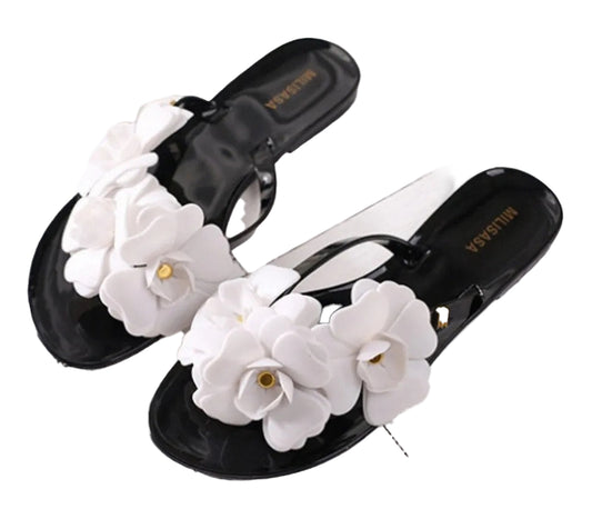 Stylish women's flower flip flops with white floral embellishments on a black base