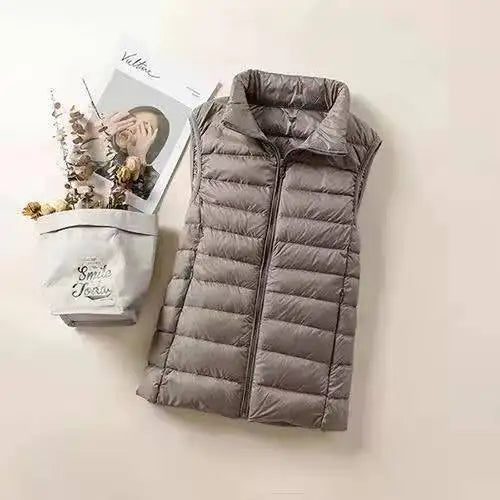 LuckeLadybug women's lightweight down vest in gray with a quilted design for warmth and style