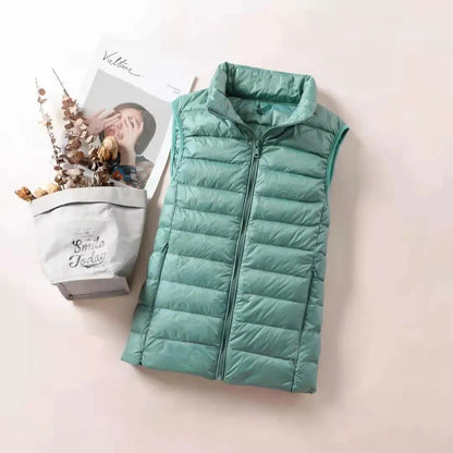 LuckeLadybug women's lightweight down vest in teal color, perfect for layering and staying warm