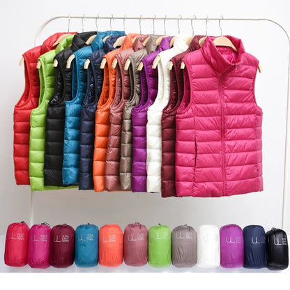 Colorful collection of women's lightweight down vest hanging on display, showcasing multiple sizes and shades