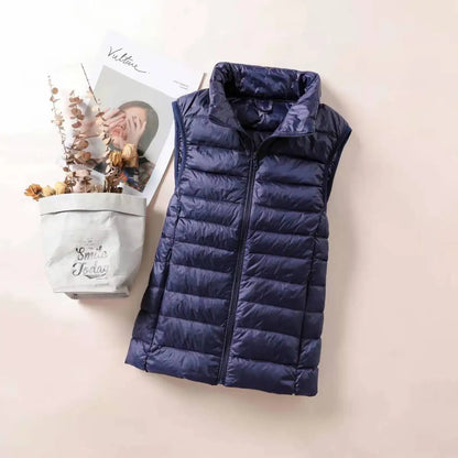 Navy women's lightweight down vest with a quilted design for stylish warmth and comfort