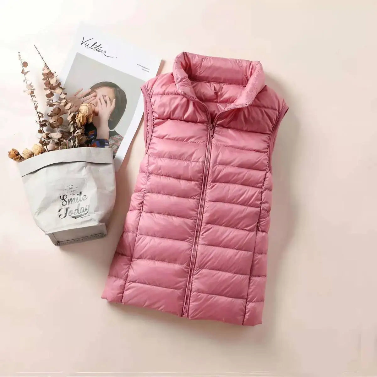 LuckeLadybug women's lightweight down vest in soft pink color, perfect for layering in cool weather