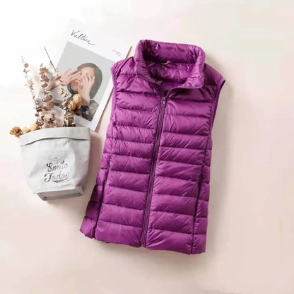 Purple women's lightweight down vest with zip front and quilted design for stylish layering
