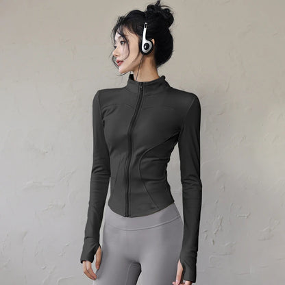 Women's long sleeve sports jacket in black with a fitted design and high collar for activewear