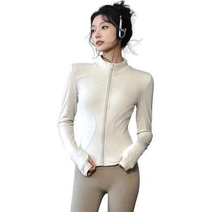 Light beige women's long sleeve sports jacket with zip front and thumbhole sleeves for activewear