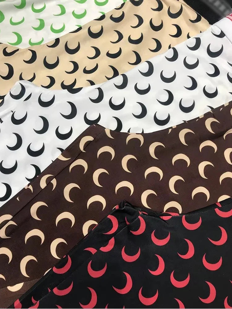 Variety of women’s printed elastic jumpsuit fabrics with crescent moon patterns in multiple colors