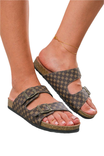 Womens PU leather slide sandals with double buckle straps and patterned design on model feet