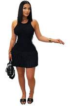 Women's sleeveless mini dress in black featuring a pleated design and a chic silhouette