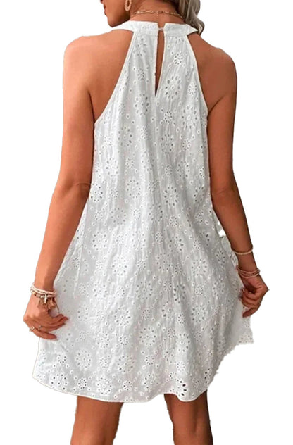 Back view of a white women's summer mini dress 2025 with floral eyelet design and keyhole detail
