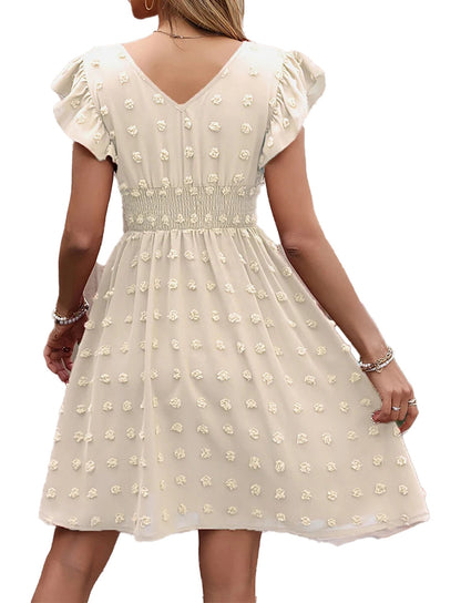 Back view of a women's summer skater mini dress with floral details and flared sleeves