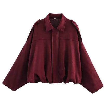 Burgundy women's vintage bomber jacket with a relaxed fit and oversized sleeves