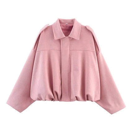 Women's vintage bomber jacket in soft pink with a relaxed fit and trendy design for stylish outerwear