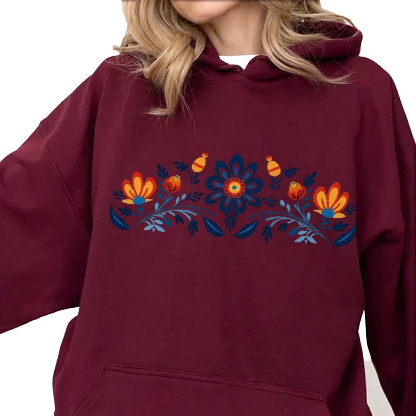 Women's washed hoodie with national symbols in burgundy featuring floral designs on the front