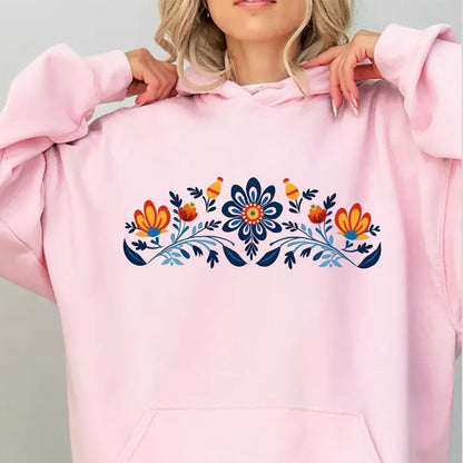 Women's washed hoodie with national symbols featuring colorful floral design on a pink background