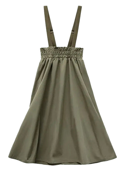 Women's workwear pinafore dress in olive green with adjustable straps and a flowy design
