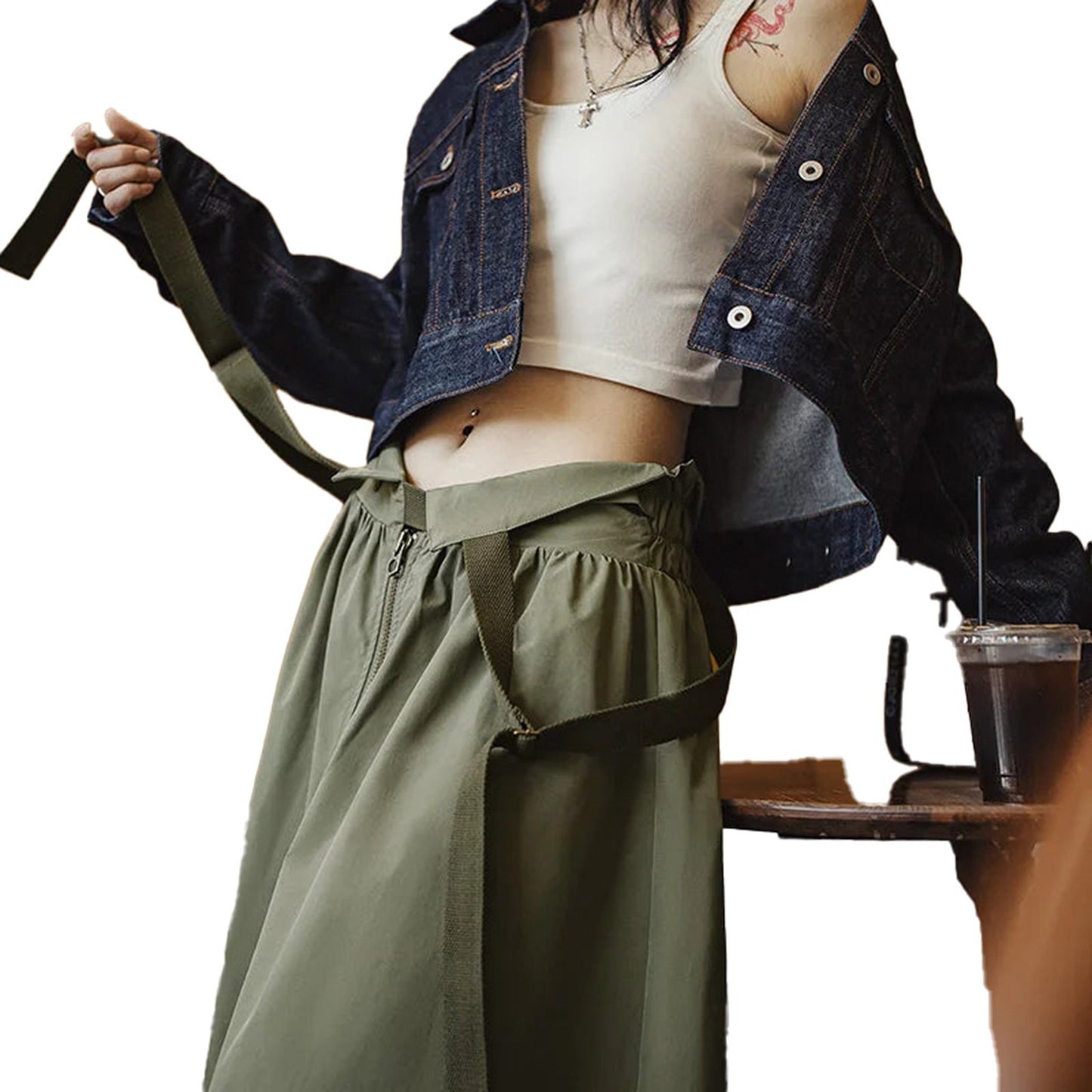 Trendy women's workwear pinafore dress styled with a cropped denim jacket and casual top