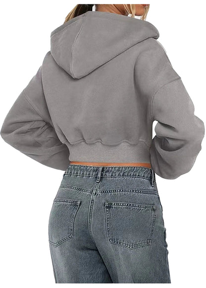 Trendy women's zip hoodie oversized in gray with a cropped fit and comfortable design.