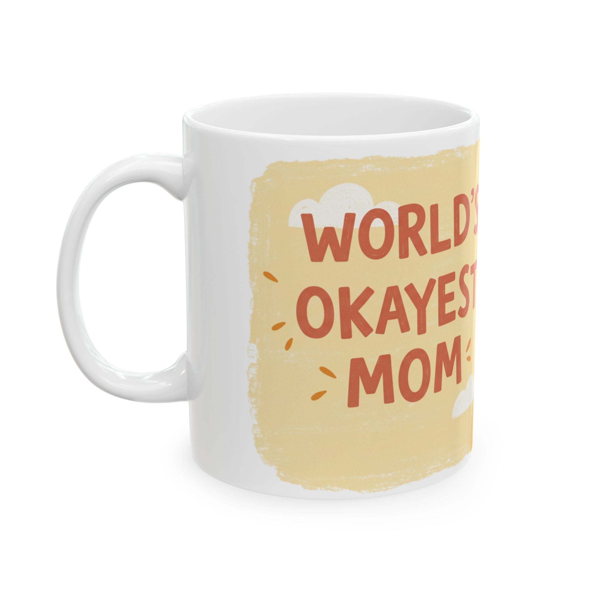 White ceramic Worlds Okayest Mom mug with beige background and playful text design