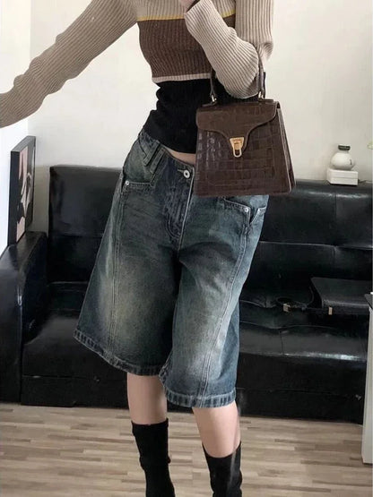 Y2K baggy denim shorts for women styled with a fitted top and a chic handbag